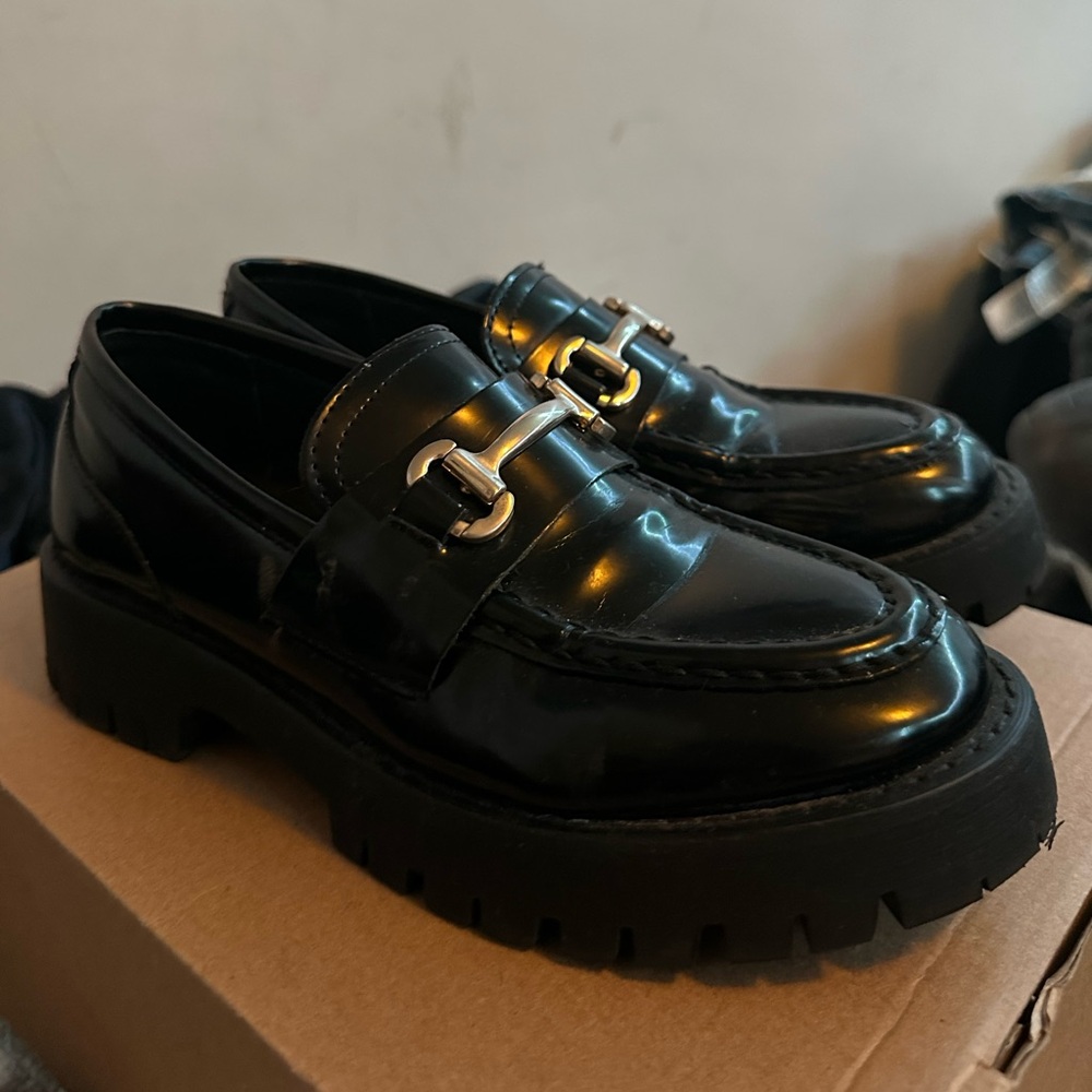 Steve Madden Black and Silver Loafers with Horsebit Detail